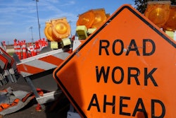 a road work ahead sign on a jobsite