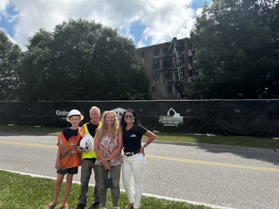 Valarie Fowler (center right) stands in front of the company's demolition of Galloway Hall for the University of North Carolina Wilmington.