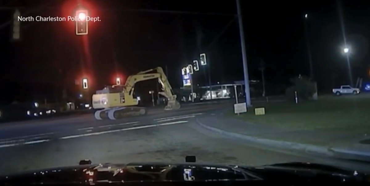 Man in Stolen Excavator Damages Building, Leads Police on Slow-Speed Chase (Video)