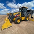 Editor's Note: Pre-release engineering model of 320 P-Tier backhoe pictured. Deere stated that production versions of the machines will have improved fit and finish.