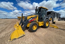 Editor's Note: Pre-release engineering model of 320 P-Tier backhoe pictured. Deere stated that production versions of the machines will have improved fit and finish.