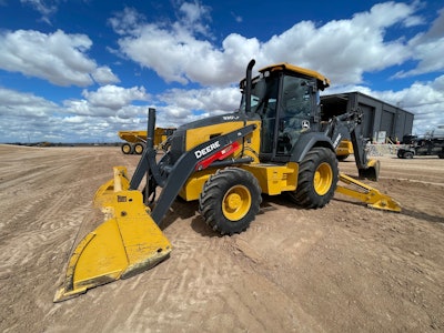 Editor's Note: Pre-release engineering model of 320 P-Tier backhoe pictured. Deere stated that production versions of the machines will have improved fit and finish.