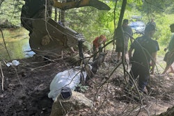 Rescuers work to remove Dancer the horse from a mud hole in Maine.
