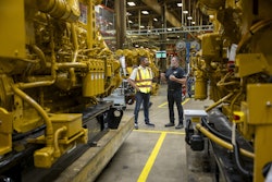 Caterpillar CEO Joe Creed, left, tours the company's Large Engine Center in Lafayette, Indiana, which is undergoing a $725 million expansion to meet growing energy demand for the tech industry's AI and cloud computing needs.