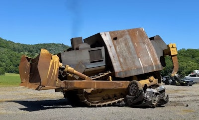 WhistlinDiesel's replica of the infamous 'Killdozer' crushes a car in their YouTube video.