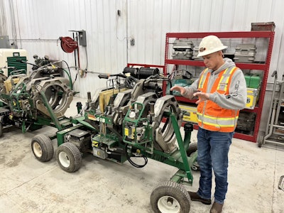 Bennett explains the physics of pipe fusion next to a McElroy 618 fusion machine.