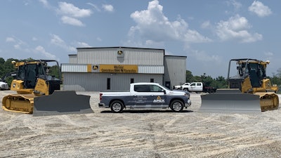 An APEX Technologies truck in front of a McCoy Construction store.