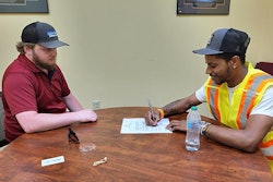 Jahwon Hartsfield (right) was recently hired as a transportation worker by NCDOT.