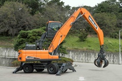 The new 62,000-pound DX270WMH-7 Wheel Material Handler gets a cab that rises hydraulically, a 23-foot loading height and a 360-degree bird's eye view camera system.
