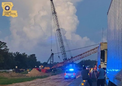 A man hopped in this crane August 16 in Louisiana and lowered the boom over westbound I-10 causing four wrecks, Louisiana State Police say.