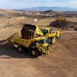 An autonomous Komatsu HD605-10 running on Komatsu Smart Quarry Autonomous, powered by Pronto, is being loaded at Komatsu’s Arizona Proving Grounds.