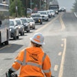 A Western Traffic Control worker directs traffic in Oregon.
