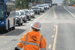 A Western Traffic Control worker directs traffic in Oregon.