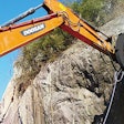 A YS-20SS rock saw installed on a Doosan DH225 excavator.