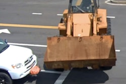 The brakes failed on the loader as it narrowly misses hitting a truck stopped August 15 at an intersection in Milford, Massachuestts.