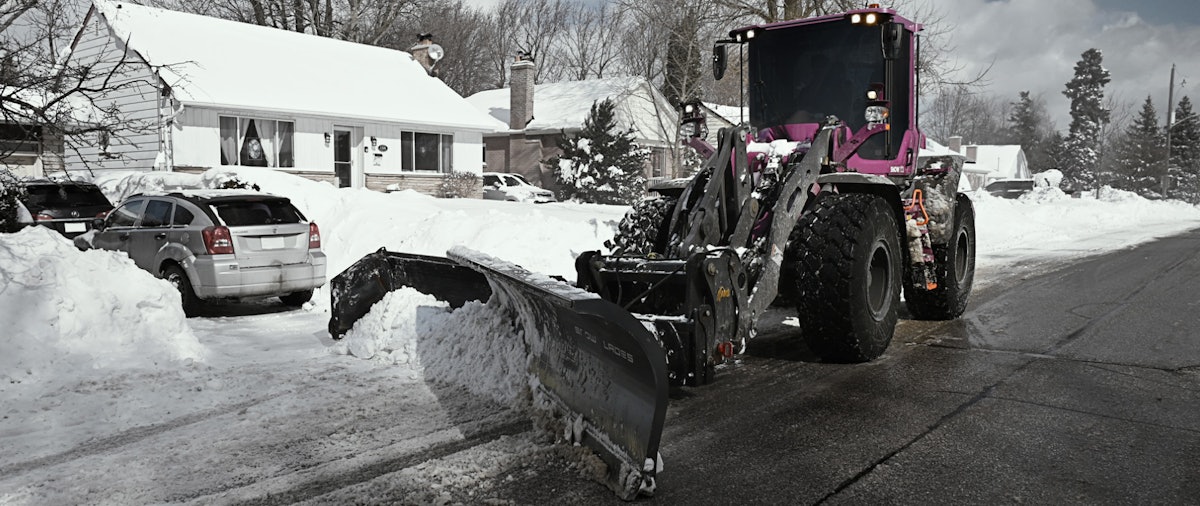 AMI’s Rid Plow Loader, Backhoe Attachment Reduces Driveway Snow Piles
