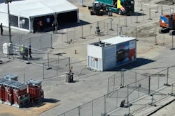 Hitachi Energy's zero-emissions construction test site consists of the HyFlex hydrogen fuel-cell generator (center right) and Hitachi's largest electric excavator, the ZE135 (right).