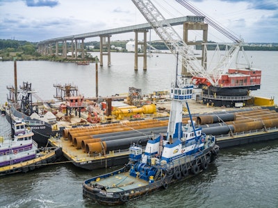 The test piles arriving by barge into Baltimore.