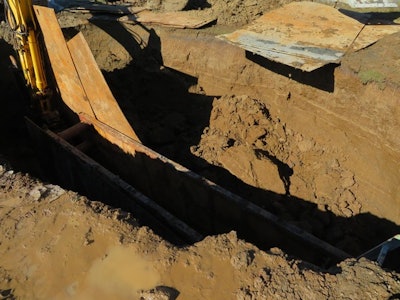 'During the inspection, the dirt wall continued to cave in approximately 20 times. You can see the sheet metal on the edge of the trench is now hanging over where there used to be soil,' says Washington L&I.