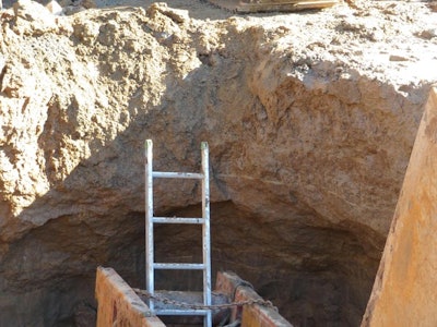 'The dirt was undermined and carved in below the wall of the trench creating a high risk of a cave-in of the area where workers were climbing in and out,' says Washington L&I. The ladder was also too low, and the trench box was too small, according to the agency.
