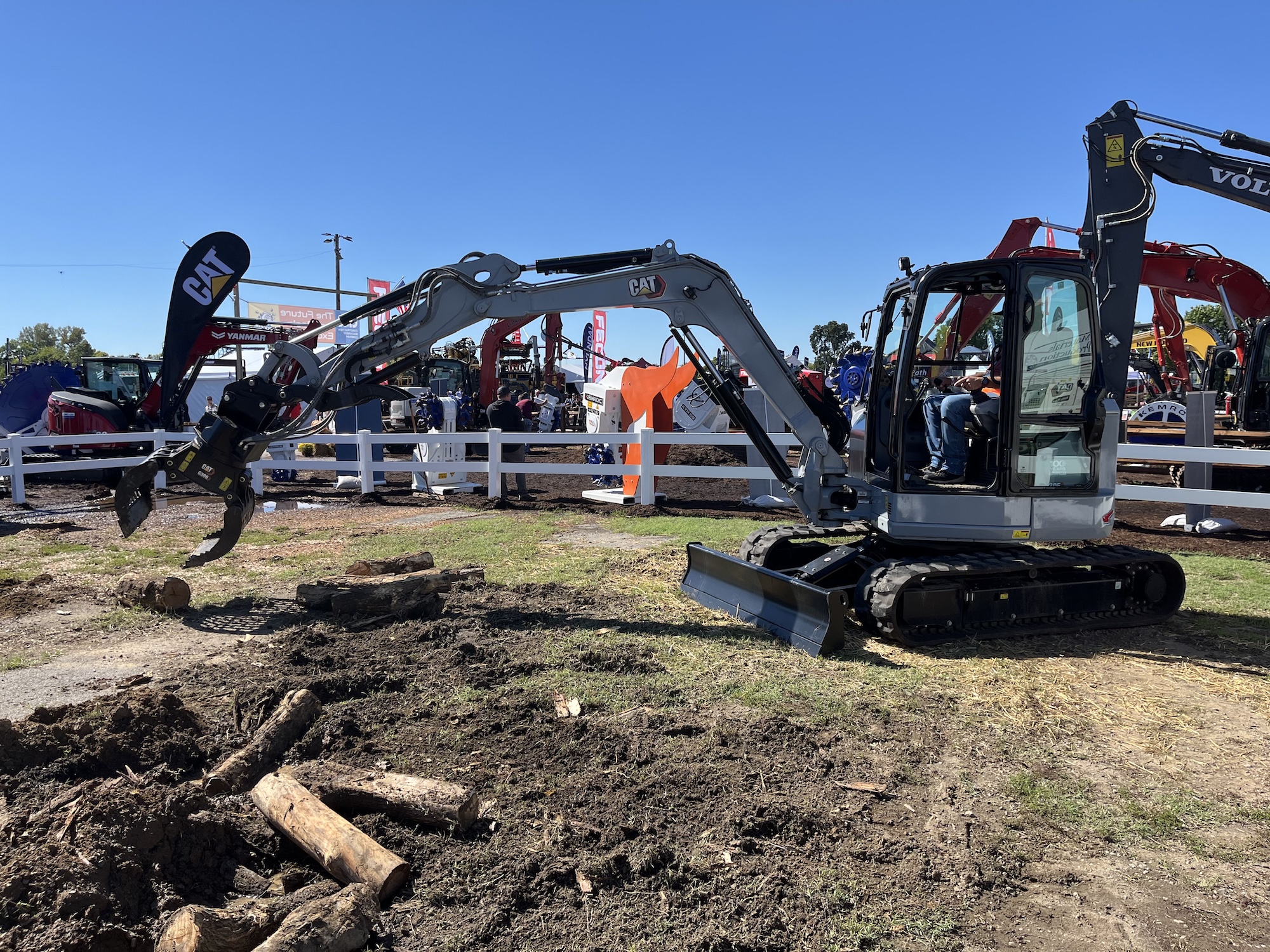 On display at Utility Expo 2025, attendees demo the new 305 CR mini excavator decked out in 'Centennial Grey' to commemorate Caterpillar's 100th anniversary.