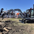 On display at Utility Expo 2025, attendees demo the new 305 CR mini excavator decked out in 'Centennial Grey' to commemorate Caterpillar's 100th anniversary.