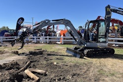 On display at Utility Expo 2025, attendees demo the new 305 CR mini excavator decked out in 'Centennial Grey' to commemorate Caterpillar's 100th anniversary.