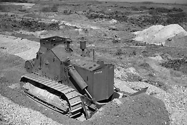 An armored Cat D7 in World War II. “If I had to give credit to the instruments and machines that won us the war in the Pacific, I would rank them in this order: submarines first, radar second, planes third, bulldozers fourth,” said U.S. Navy Admiral William F. Halsey.