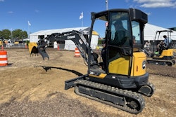 Attendees at Utility Expo 2025 try the new 26 P-Tier (foreground) and 17 P-Tier (background) compact excavators.