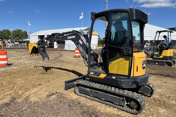 Attendees at Utility Expo 2025 try the new 26 P-Tier (foreground) and 17 P-Tier (background) compact excavators.