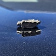 A piece of shrapnel after striking the hood of a California Highway Patrol vehicle