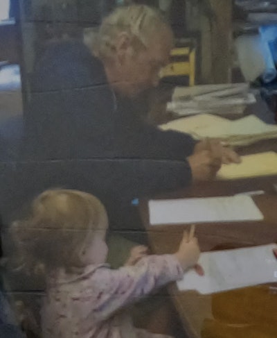 Nicole would bring her daughters into the offce, where they would spend time with Kristopher and his father (seen here).