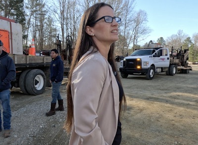 Nicole Kornegay looks on as crews begin to leave for the day.