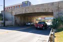The 90-year-old Saddle Creek Bridge, seen here, was assembled with historic Dodge Street curbstones.