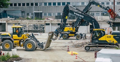 From the left, Volvo L120 Electric wheel loader, EW240 Electric material handler and EC230 Electric crawler excavator take part in the world's first all-electric demolition site.