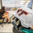 A researcher performs tests in the Virginia Tech Helmet Lab, which has released the first-ever construction helmet ratings.