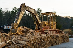 Josh Crawford, owner of Cashiers Firewood, and his team of volunteers made this life-size replica of a Takeuchi TB260 compact excavator out of firewood. He also made a TL10 compact track loader replica.
