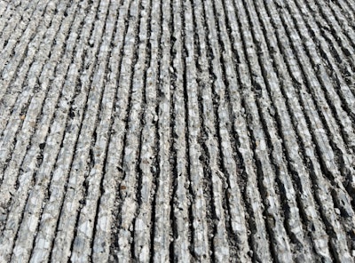 Some tines on recent concrete pours in Indiana are exhibiting early deterioration, seen here.