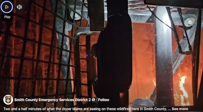 Screenshot of in-cab video released by Smith County Emergency Services District 2 of dozer fighting a wildfire.