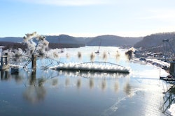 The Black Hawk Bridge falling into the Mississippi River.