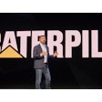 Caterpillar CEO Joe Creed unveils the company's new Cat AI Assistant at a keynote address during CES 2026 in Las Vegas.