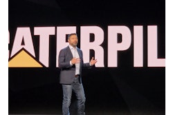 Caterpillar CEO Joe Creed unveils the company's new Cat AI Assistant at a keynote address during CES 2026 in Las Vegas.
