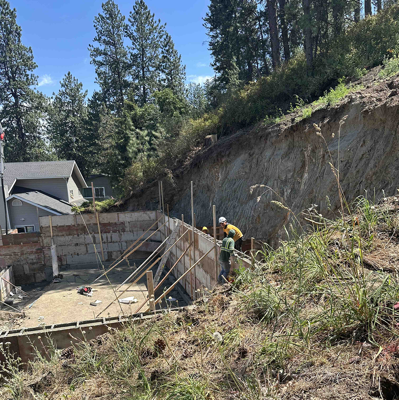 On July 9, workers were found in Spokane between a 22.5-foot-high nearly vertical dirt wall and 10-foot-high concrete forms without cave-in protection nor safe escape method, according to Washington State Department of Labor & Industries.