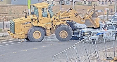 A 33-year-old man is accused of hopping the fence of a construction site January 4, hotwiring a Kawasaki wheel loader, trying to run over police and crashing into two police vehicles in Henderson, Nevada. The man was shot twice by officers.