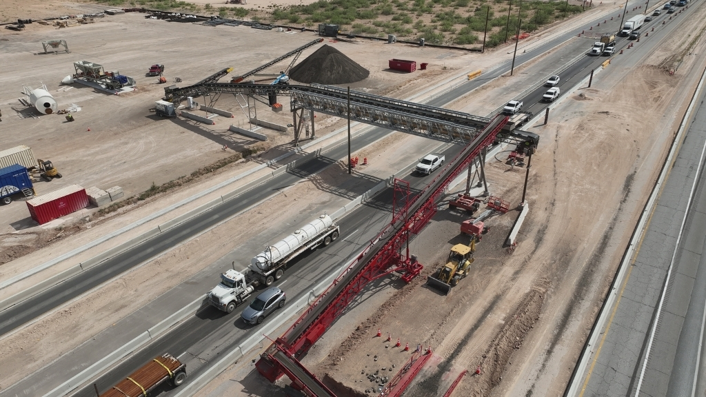 Acrow's custom bridge, seen here, supports a conveyor system to move concrete over Interstate 20.