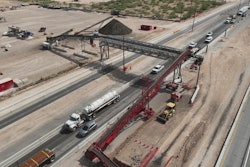 Acrow's custom bridge, seen here, supports a conveyor system to move concrete over Interstate 20.