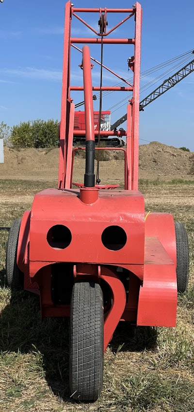 The Scoopmobile once had a towbar on the back that could be hooked to a dump truck and driven like a trailer at highway speeds, thanks to its four front truck tires.
