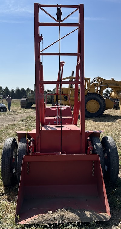 The bucket on the Scoopmobile is raised and lowered by cable and pulley and tripped open for unloading by yanking a rope.