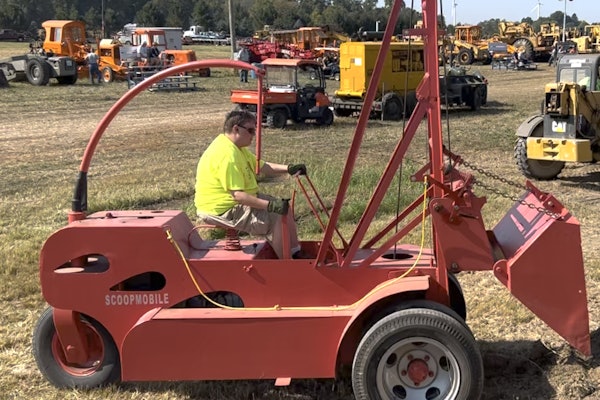A volunteer operates the late-1940s Scoopmobile at the Historical Construction Equipment Association's 2025 annual convention. Check out our video to watch it in action.