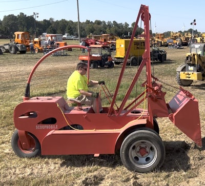 A volunteer operates the late-1940s Scoopmobile at the Historical Construction Equipment Association's 2025 annual convention. Check out our video to watch it in action.